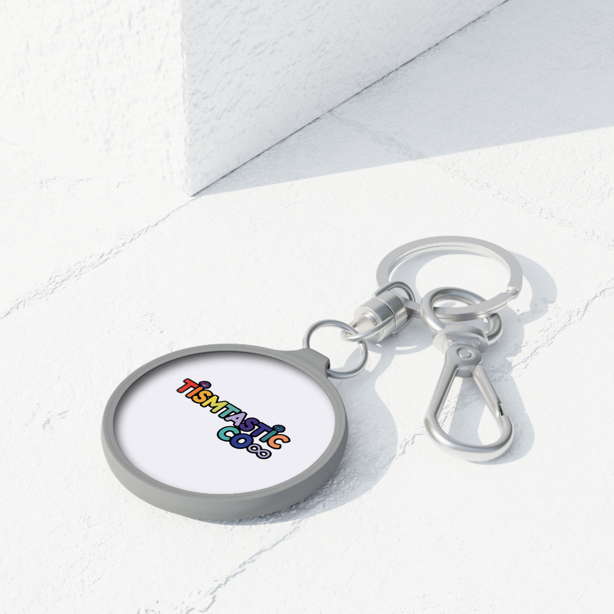 Color OG Tismtastic Logo Keyring Tag — White background Round Metal Keychain with Carabiner Clip